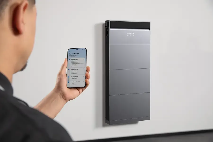 Installer commissioning a battery system through a phone app