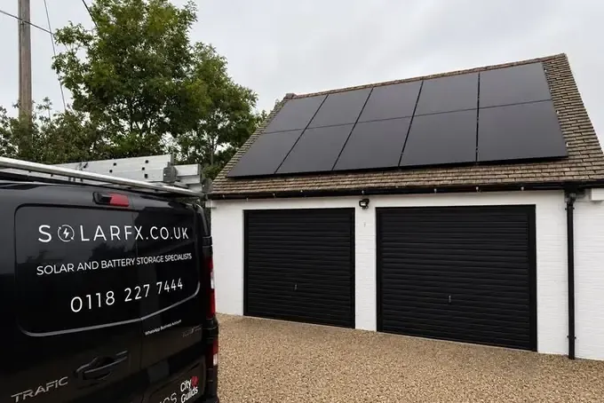 Solar panels on a double garage roof with a SolarFX van on the drive