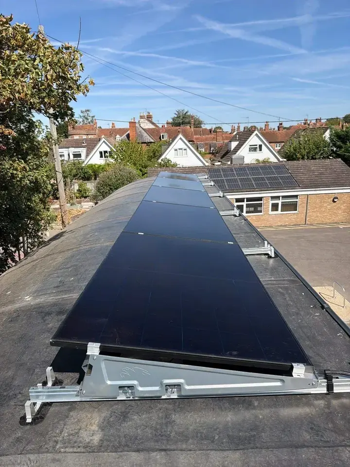 The completed array running in a single row across the flat roof