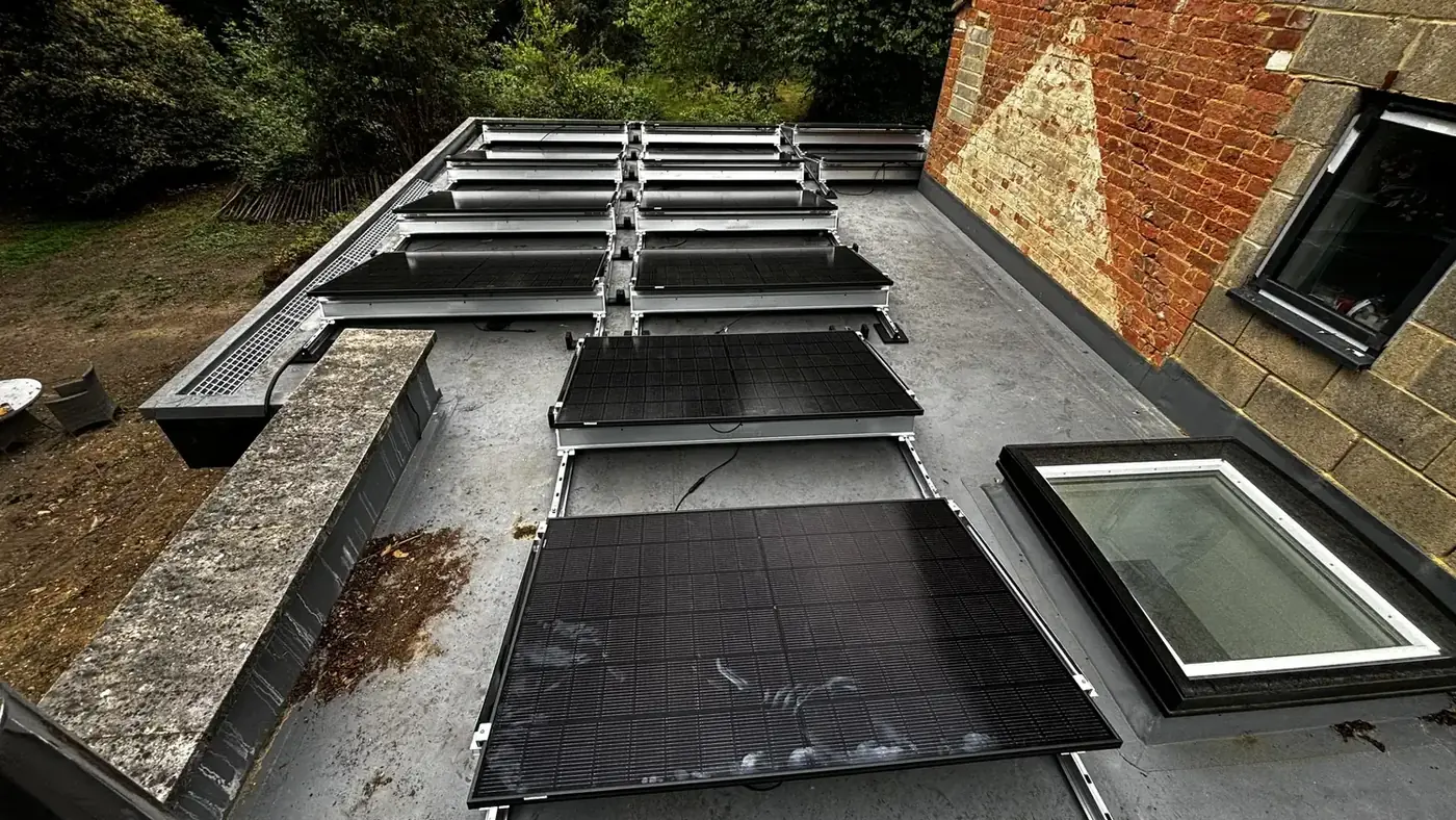 Solar panels raised on frames across a flat roof