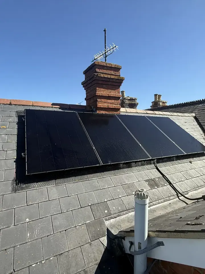 Black solar array on a slate roof in Reading, paired with a FOX EVO system